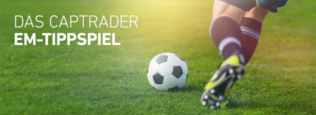 A soccer player in black socks and studded shoes is about to kick a soccer on a grass pitch. The text on the picture reads: "The CapTrader European Championship Prediction Game Plus.