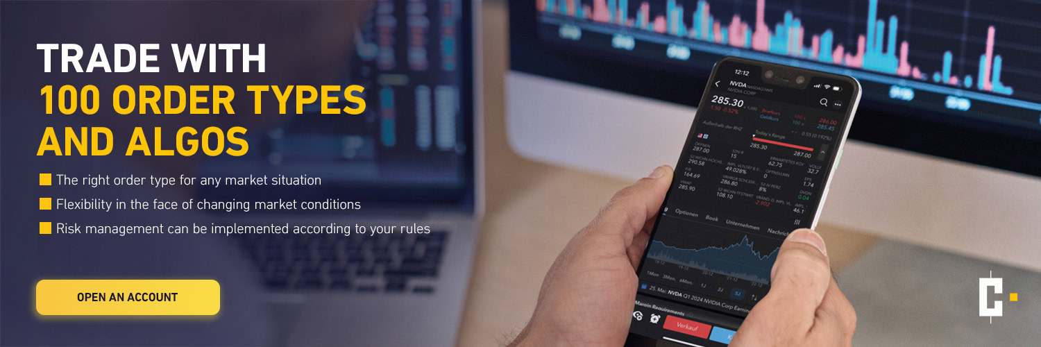 A person holds a smartphone with a trading app in front of a computer monitor with stock charts; text advertises trading with 100 order types and algos.